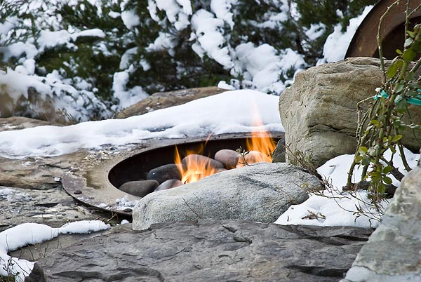 custom sunken steel fire pit set in patio