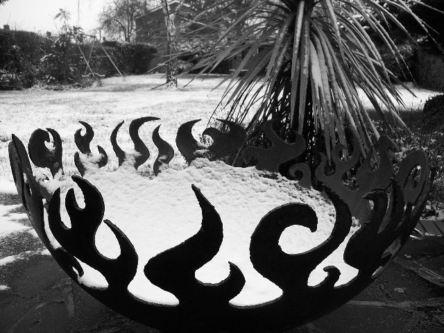 Fire Sculptural Fire Pit in England with snow