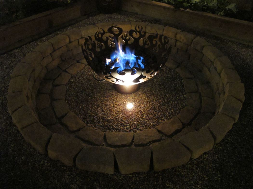 Fire Sculptural Fire Pit Closeup of the lit natural gas flame at night