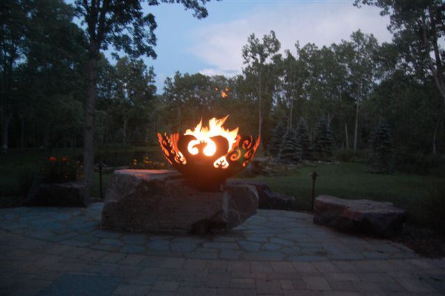 Fire Sculptural Fire Pit on giant stone with Stone Benches